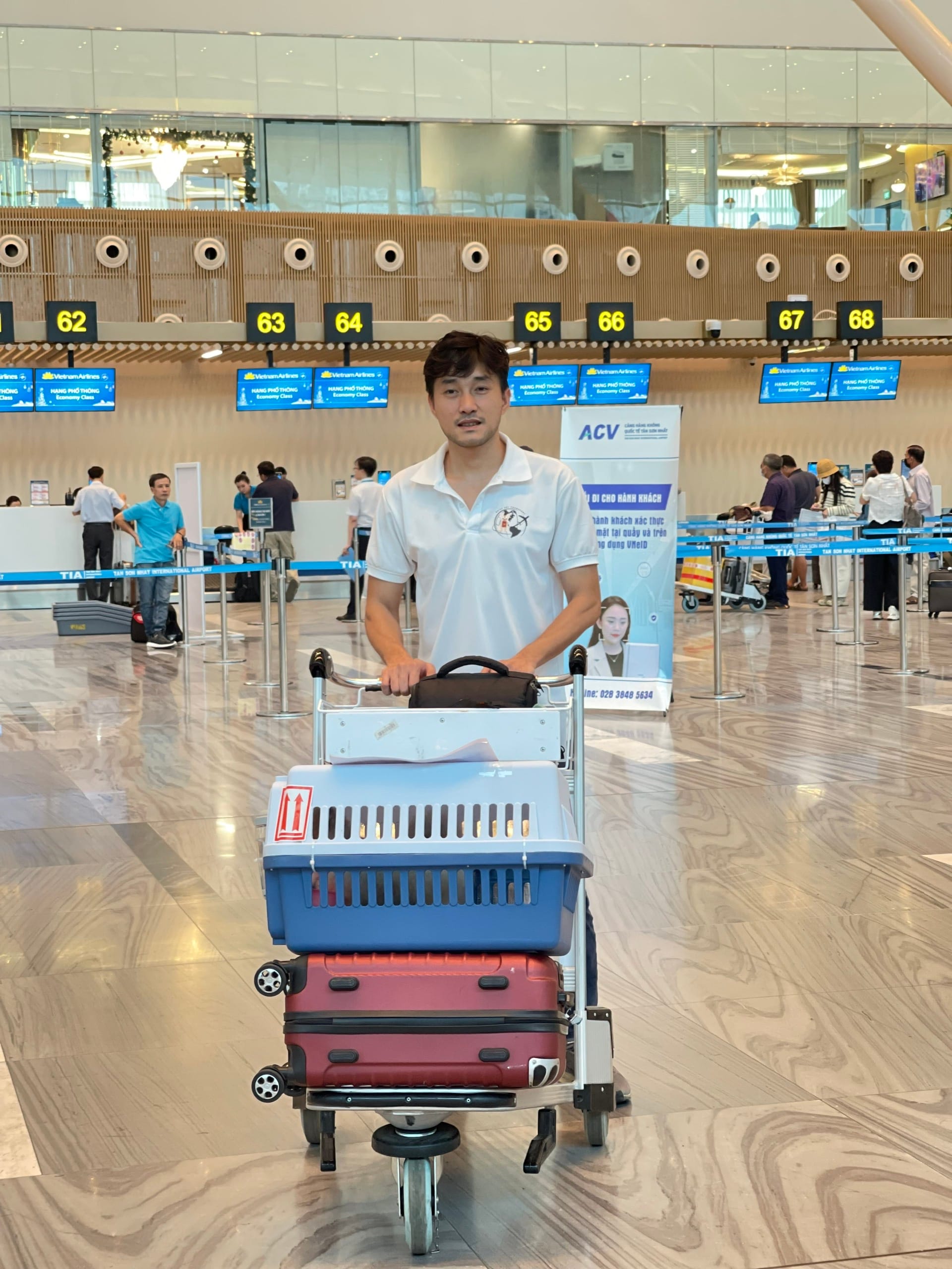 Daisy Pet staff checking China pet import documents for a dog at the airport in Vietnam