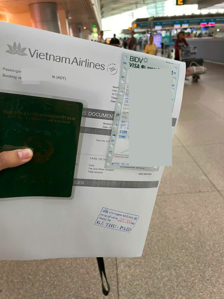 Vietnam Airlines ticket, passport and payment receipt for pet travel