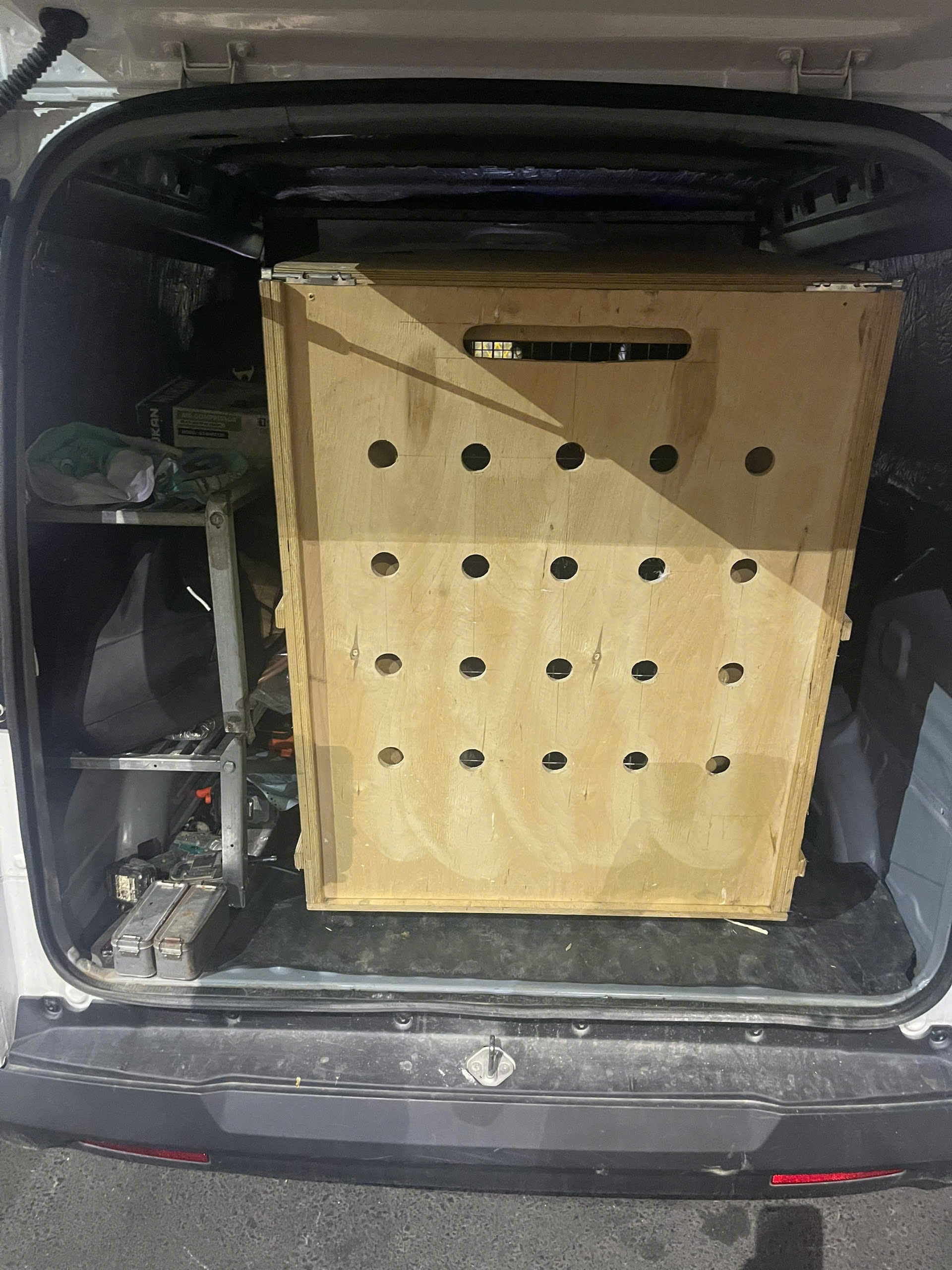 Pablo's wooden crate loaded into a transport van after release from the cargo terminal
