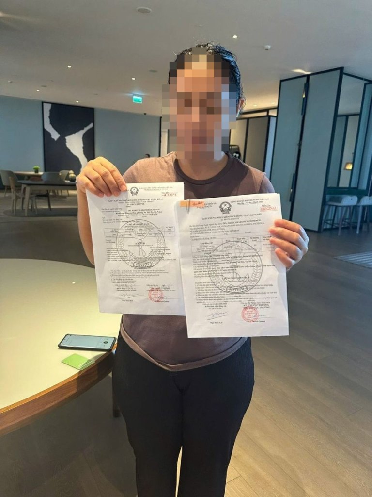 Pet owner holding a Vietnam pet import health certificate